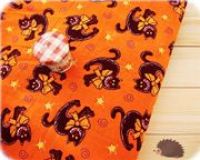 oranger Halloween Stoff Katze mit Schleife 0,5m