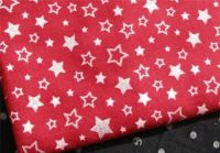 red fabric with silvery stars 0.5m