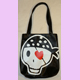 black skull bag with heart eye-patch